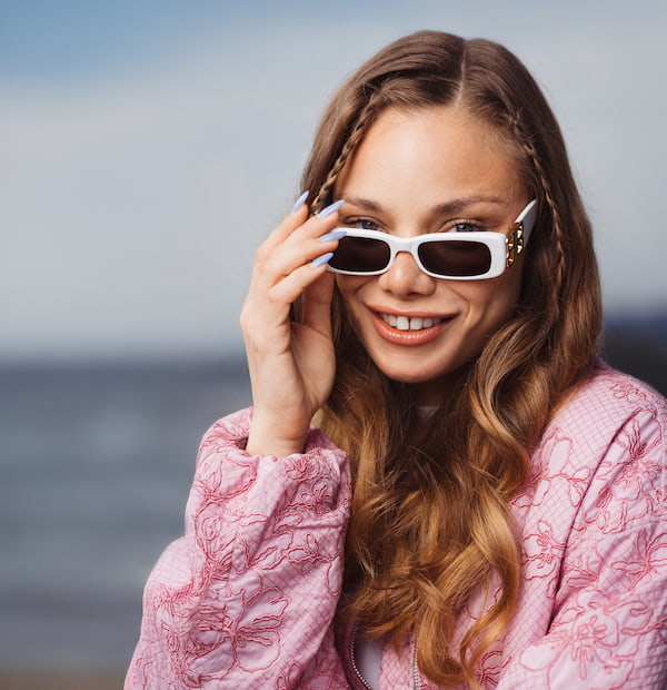 Young lady with white rectangular sunglasses