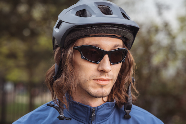 Young man with futuristic sports sunglasses