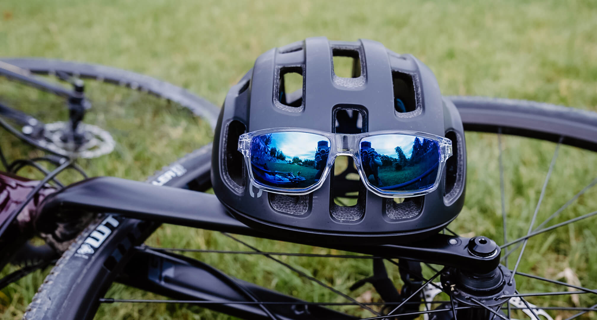 blue mirror sunglasses on bike helmet with bike