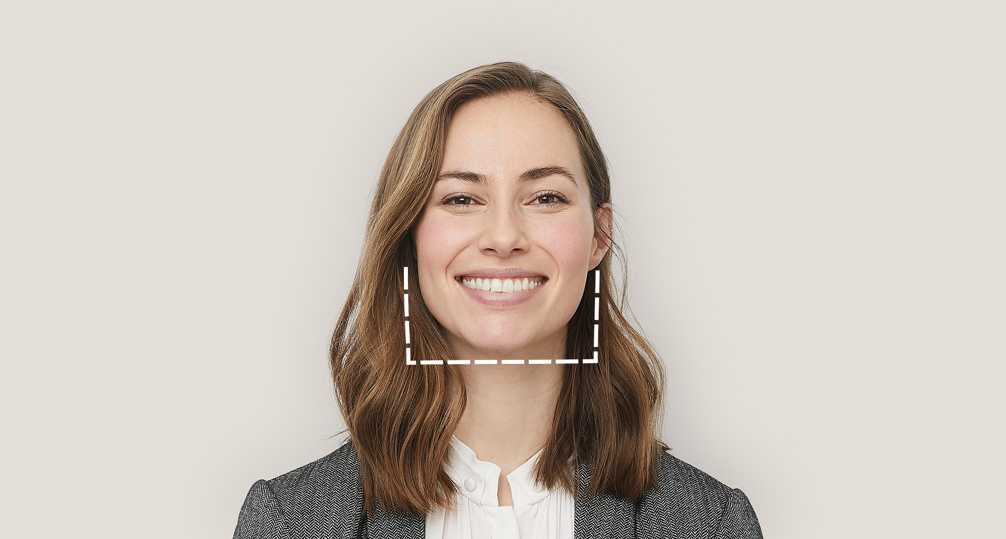 dotted outline of square chin around smiling person